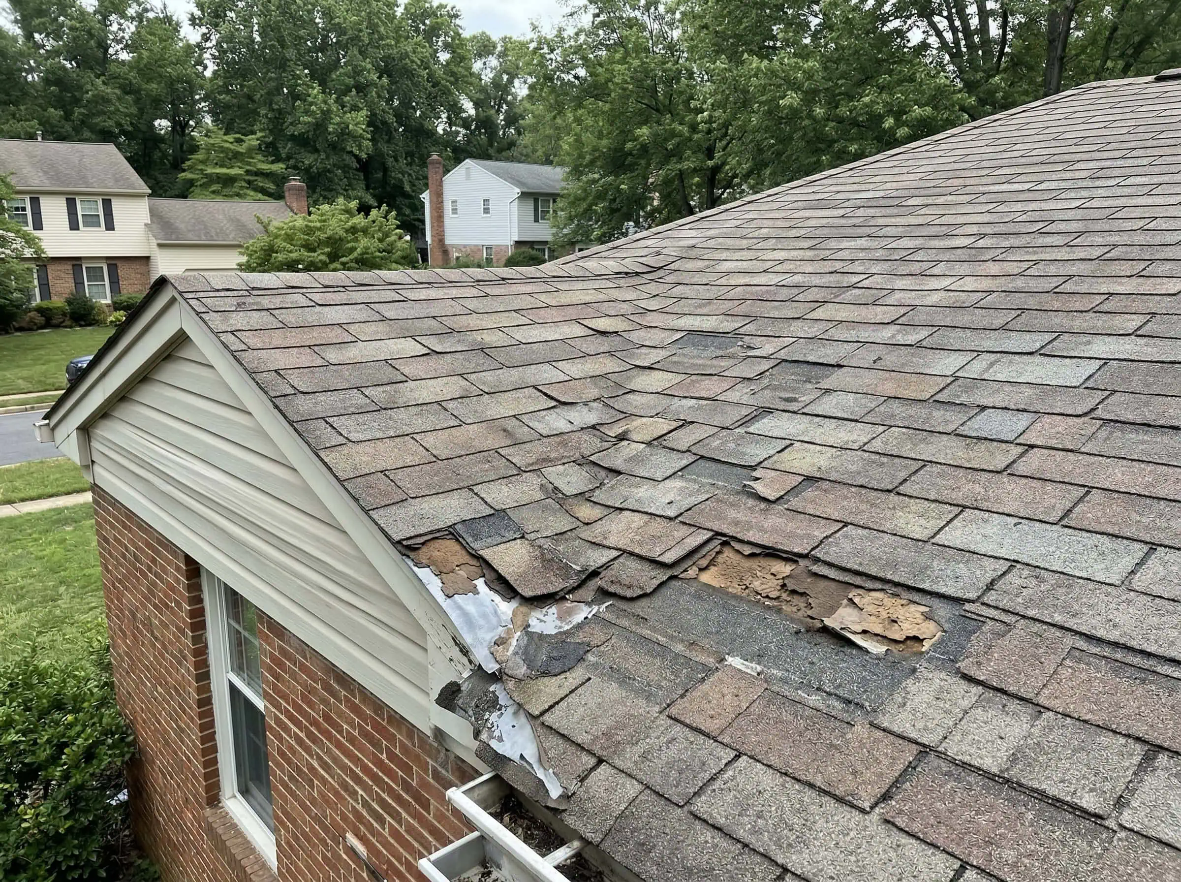 Springfield VA roof addition before repair — deteriorated felt paper with no ice and water barrier visible